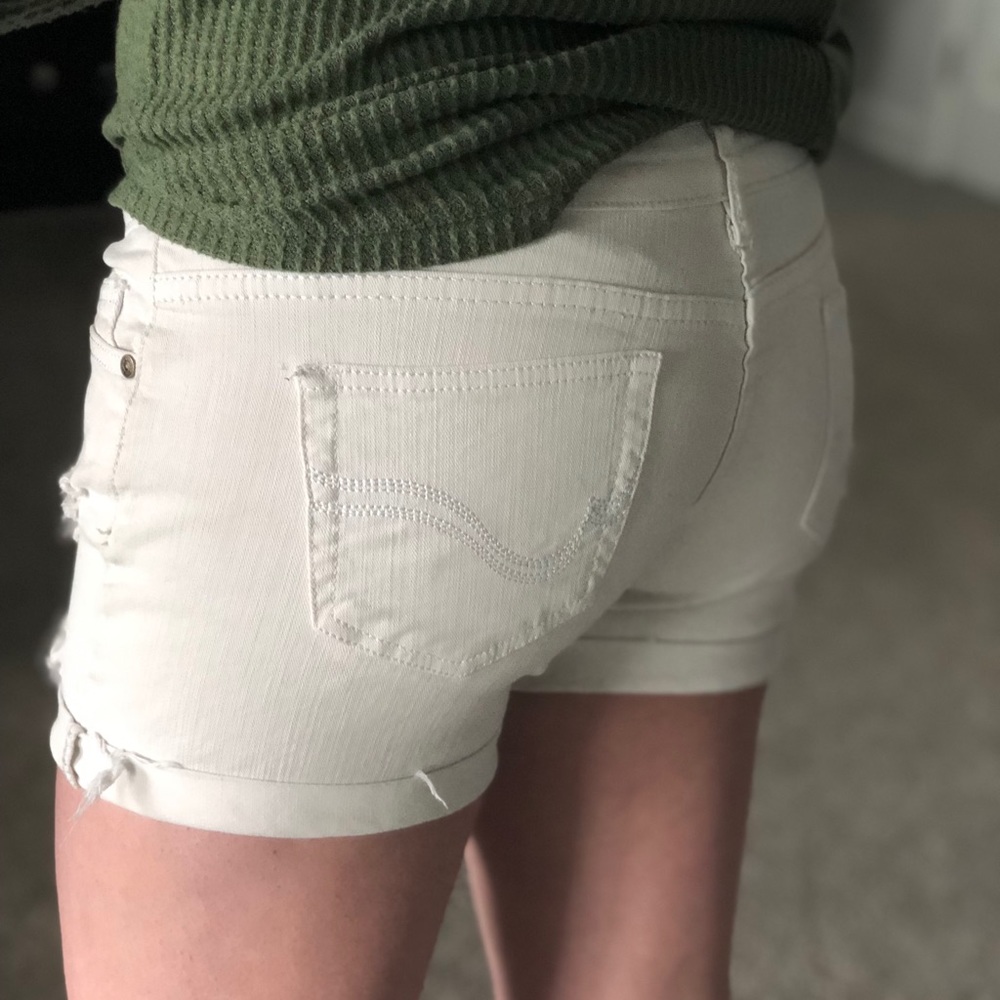 White distressed jean shorts